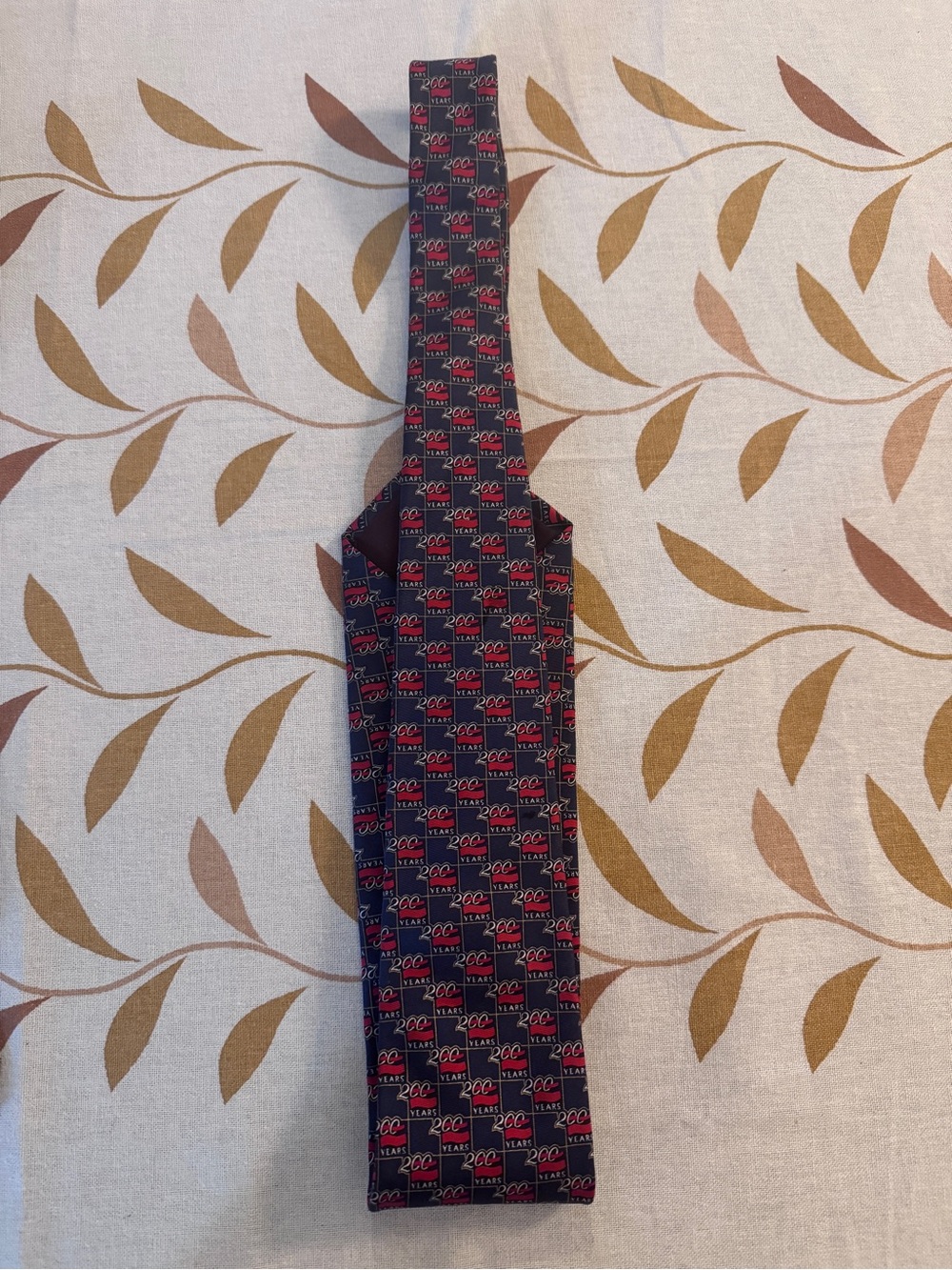 Navy and Red Patterned Men's Tie with Repeating Logo